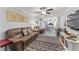 Relaxing living room with a brown leather sectional sofa, creating a cozy atmosphere at 10301 Gulf Blvd # 201, Treasure Island, FL 33706