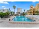 Refreshing community pool with lounge chairs at 10301 Gulf Blvd # 201, Treasure Island, FL 33706