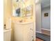 Bathroom featuring a white vanity with mirrored medicine cabinet and a toilet to the side at 306 Friar Ct # B, Sun City Center, FL 33573