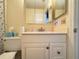 Bathroom with a classic white vanity and mirrored medicine cabinet at 306 Friar Ct # B, Sun City Center, FL 33573