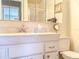 Bathroom with a single sink vanity, mirrored medicine cabinet and a toilet at 306 Friar Ct # B, Sun City Center, FL 33573