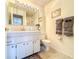 Bathroom featuring a vanity with cabinet storage and a toilet at 306 Friar Ct # B, Sun City Center, FL 33573