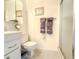 Bathroom featuring a vanity and cabinet storage, a toilet, and a glass-enclosed shower at 306 Friar Ct # B, Sun City Center, FL 33573