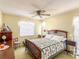 Bedroom with a bed, a dresser, a ceiling fan, and a window at 306 Friar Ct # B, Sun City Center, FL 33573