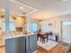 Bright dining room featuring a chandelier, wood floors, and sliding doors to a sunroom at 306 Friar Ct # B, Sun City Center, FL 33573