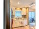 Bright kitchen features stainless steel appliances, granite countertops, and ample cabinet space at 306 Friar Ct # B, Sun City Center, FL 33573