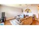 Relaxing living room features a ceiling fan, comfortable seating, and area rug at 306 Friar Ct # B, Sun City Center, FL 33573