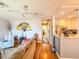 Inviting living room boasts a decorative ceiling fan and an eye-catching, oversized paper fan accent piece at 306 Friar Ct # B, Sun City Center, FL 33573