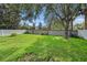 Large backyard with grass and privacy fence at 4124 Beaumont Loop, Spring Hill, FL 34609