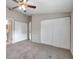 Well-lit bedroom with double closets and neutral wall tones at 16203 Lakehead Ct, Tampa, FL 33618