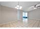 Dining room with sliding glass doors leading to a screened porch at 16203 Lakehead Ct, Tampa, FL 33618