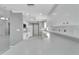 Bright kitchen with white cabinets, granite countertops, and stainless steel appliances at 2206 Mayfield Palms Ln # 69, Sun City Center, FL 33573