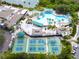 Aerial view of community pool and pickleball courts at 2206 Mayfield Palms Ln # 69, Sun City Center, FL 33573