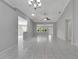 Open living area with high ceilings and neutral gray walls at 2206 Mayfield Palms Ln # 69, Sun City Center, FL 33573