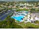 Community pool, tennis, pickleball courts, and clubhouse at 2206 Mayfield Palms Ln # 69, Sun City Center, FL 33573