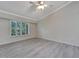 Bright and airy living room with gray flooring and large window at 2206 Mayfield Palms Ln # 69, Sun City Center, FL 33573