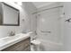 Clean bathroom with tub shower, vanity, and updated fixtures at 2206 Mayfield Palms Ln # 69, Sun City Center, FL 33573