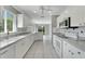 Modern kitchen with white cabinets, granite countertops, and breakfast nook at 2206 Mayfield Palms Ln # 69, Sun City Center, FL 33573