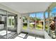 Bright sunroom with tile floors and view of backyard at 2206 Mayfield Palms Ln # 69, Sun City Center, FL 33573