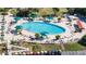 Relaxing oval pool with plenty of lounge chairs at 2206 Mayfield Palms Ln # 69, Sun City Center, FL 33573