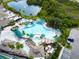 Large, freeform community pool with ample lounge space at 2206 Mayfield Palms Ln # 69, Sun City Center, FL 33573