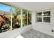 Sunroom features multiple windows and backyard view at 2206 Mayfield Palms Ln # 69, Sun City Center, FL 33573