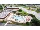 Relaxing community pool with plenty of lounge chairs at 2206 Mayfield Palms Ln # 69, Sun City Center, FL 33573