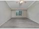 Living room features gray vinyl plank flooring and ceiling fan at 2206 Mayfield Palms Ln # 69, Sun City Center, FL 33573