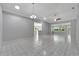 Bright living room with tile floors, high ceilings and ceiling fans at 2206 Mayfield Palms Ln # 69, Sun City Center, FL 33573