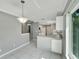 Kitchen boasts white cabinets and ample counter space at 2206 Mayfield Palms Ln # 69, Sun City Center, FL 33573