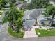 Aerial view of house, landscaping, and driveway at 2206 Mayfield Palms Ln # 69, Sun City Center, FL 33573