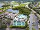 Community clubhouse with pool, tennis, and pickleball courts at 2206 Mayfield Palms Ln # 69, Sun City Center, FL 33573