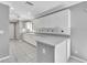 White kitchen cabinets and a large window overlooking backyard at 2206 Mayfield Palms Ln # 69, Sun City Center, FL 33573