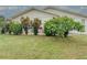 Spacious backyard with patio, lush landscaping, and room for outdoor entertaining at 306 Friar Ct # B, Sun City Center, FL 33573