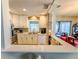 Bright kitchen boasts updated white cabinets and stainless steel appliances at 306 Friar Ct # B, Sun City Center, FL 33573