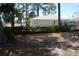 View of the backyard featuring an exterior shot of the home at 1503 N Conrad Ave, Sarasota, FL 34237