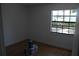 Light and airy bedroom featuring wood-look floors and a bright window at 1503 N Conrad Ave, Sarasota, FL 34237