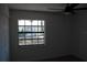 Bright bedroom features a window view and ceiling fan at 1503 N Conrad Ave, Sarasota, FL 34237