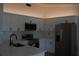 Bright kitchen with quartz countertops, white cabinetry and stainless steel appliances at 1503 N Conrad Ave, Sarasota, FL 34237