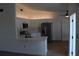 Bright kitchen with quartz countertops, white cabinetry and stainless steel appliances at 1503 N Conrad Ave, Sarasota, FL 34237