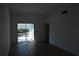 Light-filled living room with sliding glass door at 1503 N Conrad Ave, Sarasota, FL 34237