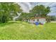 Quaint single story home with overgrown yard needing landscaping at 10912 672 Hwy, Riverview, FL 33579