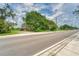 Road view of house and vacant lot at 10912 672 Hwy, Riverview, FL 33579