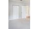 Spacious bedroom with carpet, double doors to closet and en-suite bathroom at 2220 Chianti Pl # 8-0812, Palm Harbor, FL 34683