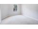 Bright bedroom featuring neutral carpeting and a window at 2220 Chianti Pl # 8-0812, Palm Harbor, FL 34683