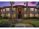 Attractive condo building exterior at dusk at 2220 Chianti Pl # 8-0812, Palm Harbor, FL 34683