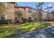 Two-story building with tan exterior and lush landscaping at 2220 Chianti Pl # 8-0812, Palm Harbor, FL 34683