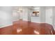 Bright living room with wood flooring and access to kitchen and dining areas at 2220 Chianti Pl # 8-0812, Palm Harbor, FL 34683