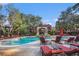 Resort-style pool with plenty of lounge chairs and a shaded seating area at 2220 Chianti Pl # 8-0812, Palm Harbor, FL 34683