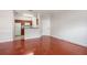 Open living room showcasing wood floors and kitchen at 2220 Chianti Pl # 8-0812, Palm Harbor, FL 34683